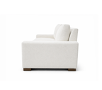 A side view of a modern two-seater sofa in off-white textured fabric with dark brown wooden feet, shown from a side profile view on a solid white background.